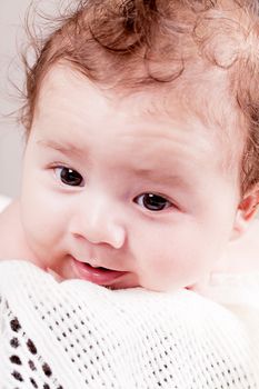 sweet little baby infant toddler on white  blanket in basket at home