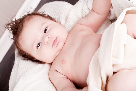 sweet little baby infant toddler on white  blanket in basket at home