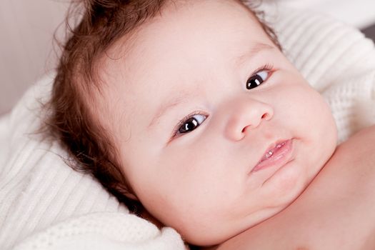 sweet little baby infant toddler on white  blanket in basket at home