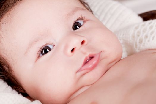 sweet little baby infant toddler on white  blanket in basket at home