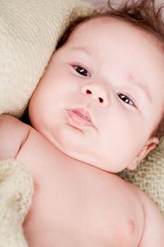 sweet little baby infant toddler on white  blanket in basket at home