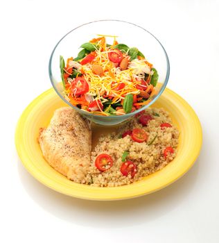 Healthy lunch or dinner with grilled chicken, quinoa and a salad on white background