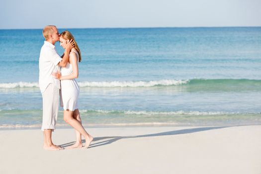 happy young couple in love having fun on the beach blue sky and sunshine 