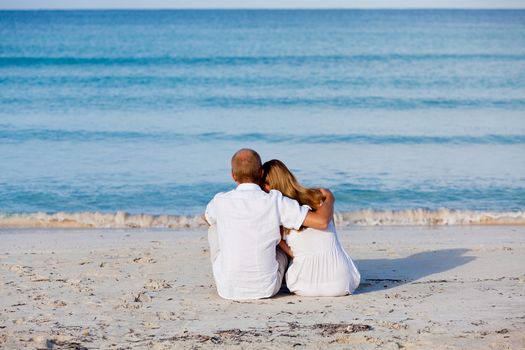 happy young couple in love having fun on the beach blue sky and sunshine 