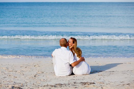 happy young couple in love having fun on the beach blue sky and sunshine 