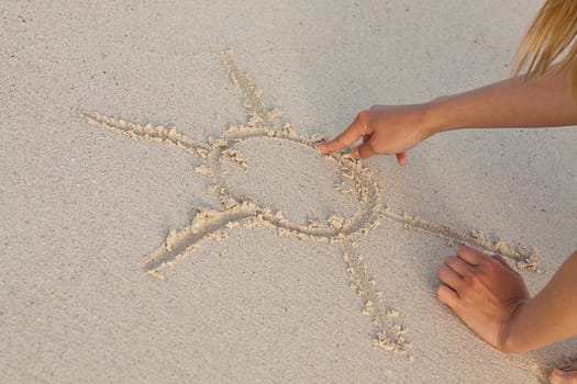hand writing in sand in summer holiday vacation on beach 