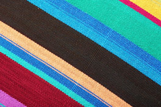 New textile fabric in multicolored stripes as a natural background