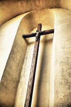 old crucifix on a wall, low angle view