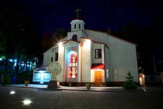 small church next Alexander Nevsky Cathedral in Kamianets-Podilskyi, Ukraine, at night