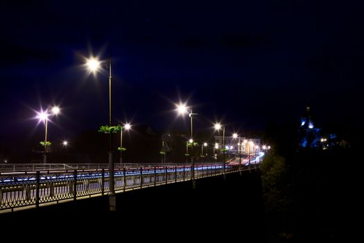 bridge over Smotrych River in Kamianets-Podilskyi, Ukraine, at night