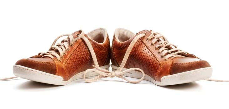 brown leather trainer shoe isolated on white