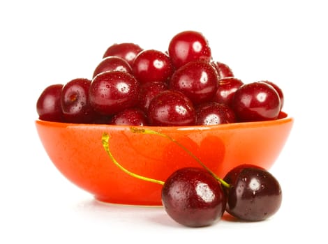 bowl full of cherries isolated on white background