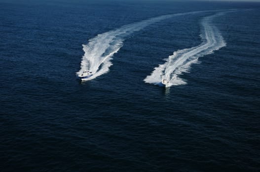 Two boats racing in Atlantic Ocean