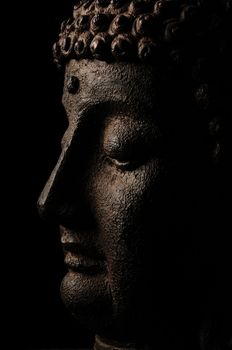 Buddha on black background in mediation