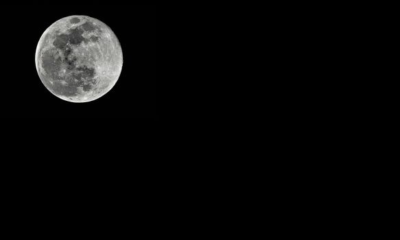 Detailed full moon on black background