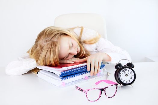 tired businesswoman sleeping in office on a table