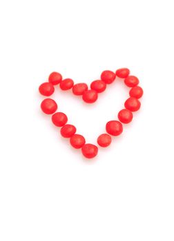 Heart made from red hots isolated on white for Valentine's Day