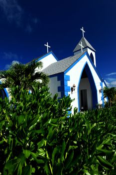 Blue and white church in tropical climate in the Bahamas