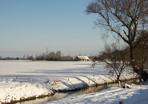 snow in the winter with ranch on the background