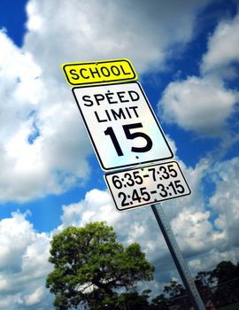 Speed limit sign in a school zone with 15 miles per hour