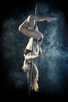 young sexy pole dance woman, dark background