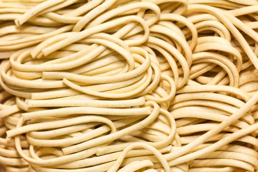 A background of raw egg noodles