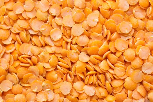 A background of raw red lentils