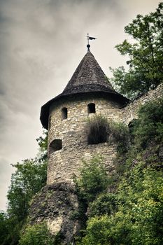 abandoned medieval castle at stormy summer day