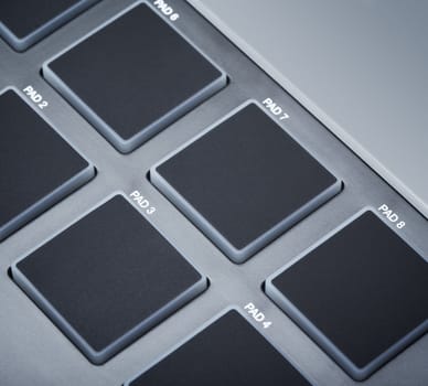 pads on digital midi keyboard, close up