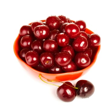 bowl full of cherries isolated on white background