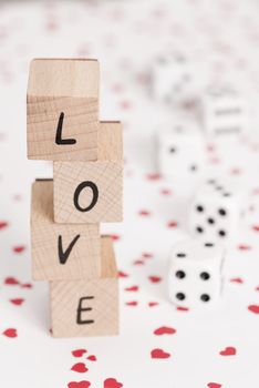 The word love alongside white dice.