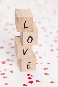 The word love constructed out ouf wooden blocks.