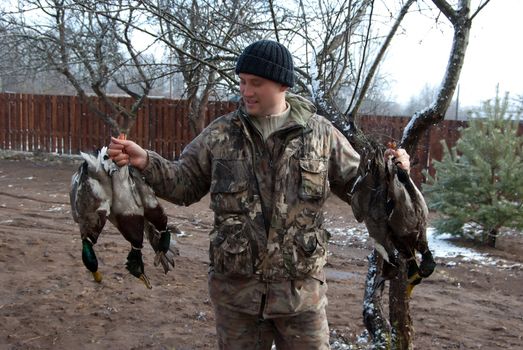 Outdoor shot of hunter shows the extracted game.