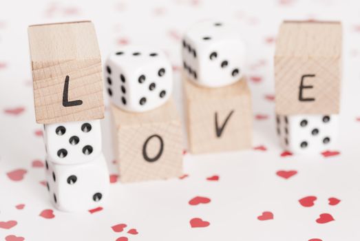 The word love alongside white dice.