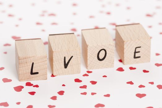 The word love constructed out ouf wooden blocks.