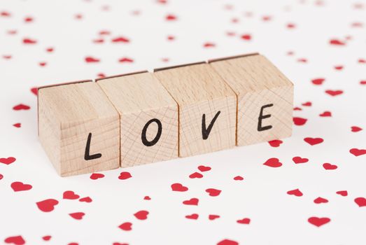 The word love constructed out ouf wooden blocks.