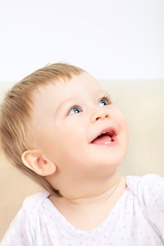 beautiful laughing baby with blue eyes portrait