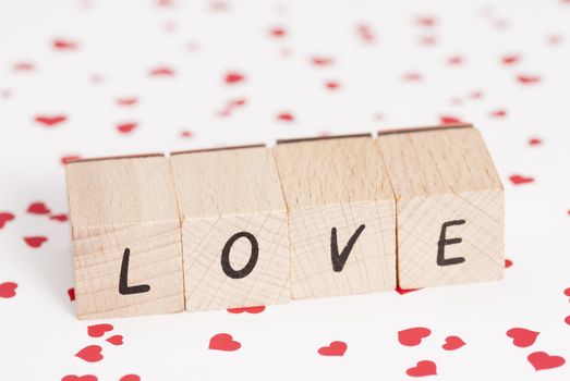 The word love constructed out ouf wooden blocks.