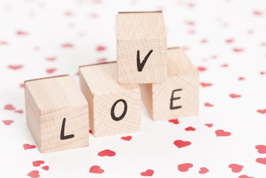 The word love constructed out ouf wooden blocks.