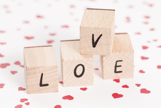 The word love constructed out ouf wooden blocks.