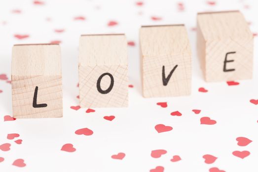 The word love constructed out ouf wooden blocks.