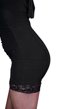 Sexy female figure in black stockings on white background.