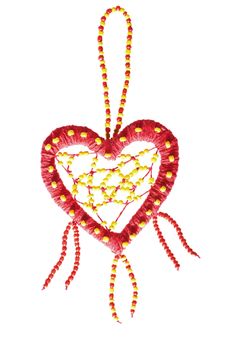 Red heart of colored beads on a white background.