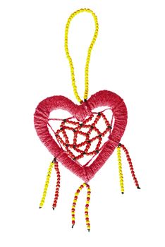 Red heart of colored beads on a white background.