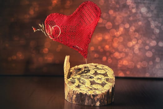 Red heart on a background of beautiful bokeh.