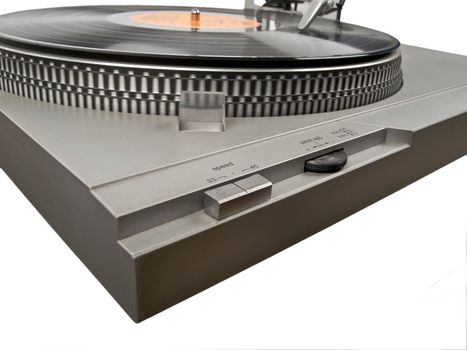 angle view of turntable and record playing on