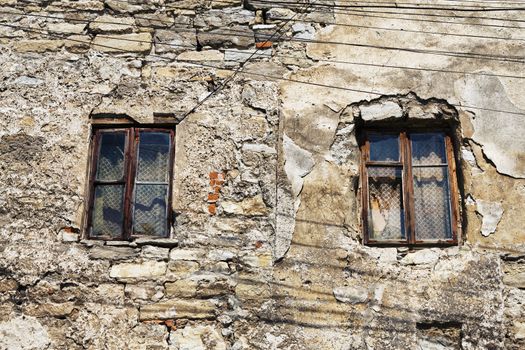 two window of abandoned house at day