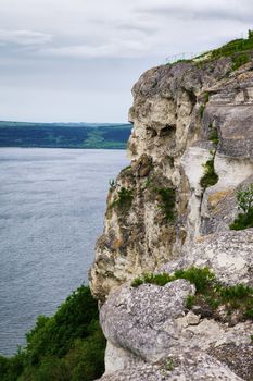 high rock over river at cloudy day, Dniester, Ukraine