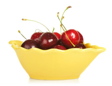 bowl full of cherries isolated on white background