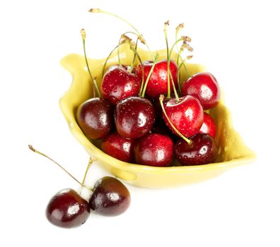 bowl full of cherries isolated on white background